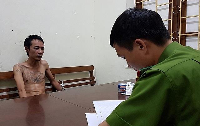 Đối tượng Hoàng Anh Tuấn tại cơ quan công an