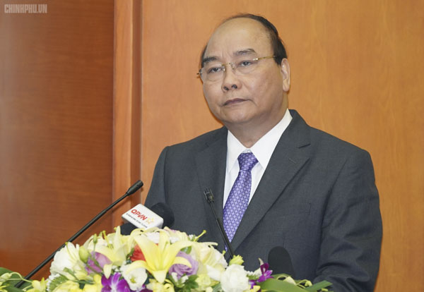 Thủ tướng Nguyễn Xuân Phúc đến dự hội nghị. Ảnh: QUANG HIẾU
