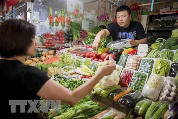Một quầy bán rau quả tại chợ ở Bắc Kinh, Trung Quốc. (Nguồn: AFP)
