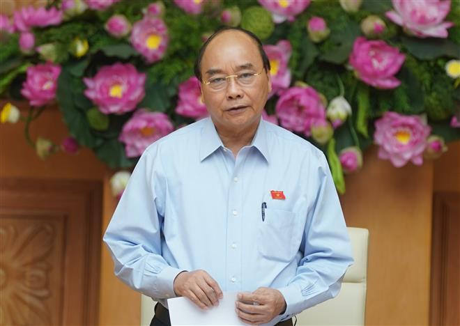 Thủ tướng Nguyễn Xuân Phúc phát biểu tại cuộc họp. Ảnh: VGP/Quang Hiếu 