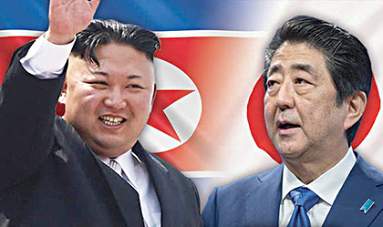 Thủ tướng Nhật Bản Shinzo Abe (bìa phải) và nhà lãnh đạo Triều Tiên Kim Jong-un. 