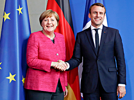 Thủ tướng Đức Angela Merkel (trái) và Tổng thống Pháp Emmanuel Macron.