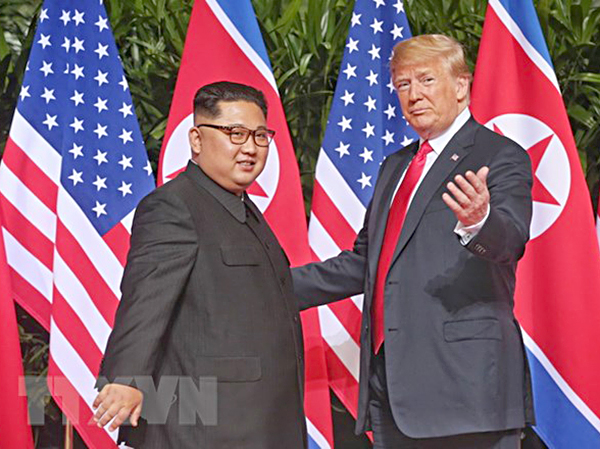 Tổng thống Mỹ Donald Trump và nhà lãnh đạo Triều Tiên Kim Jong-un tại cuộc hội đàm ở Singapore ngày 12-6.