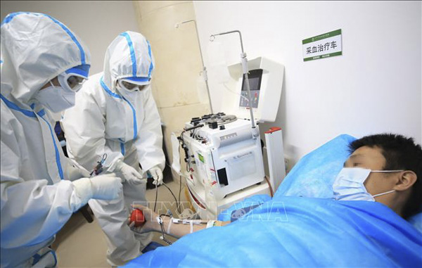 Bệnh nhân nhiễm COVID-19 điều trị tại bệnh viện ở Hồ Nam, Trung Quốc. (Nguồn: THX)