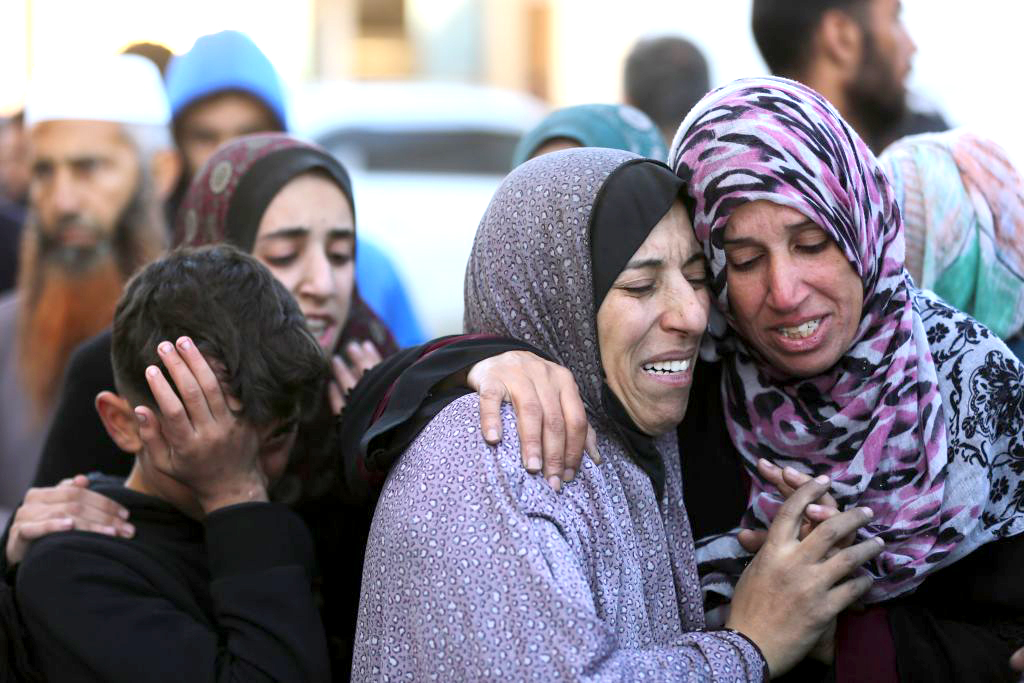 Nỗi đau của người thân các nạn nhân thiệt mạng trong cuộc không kích của Israel xuống Dải Gaza.